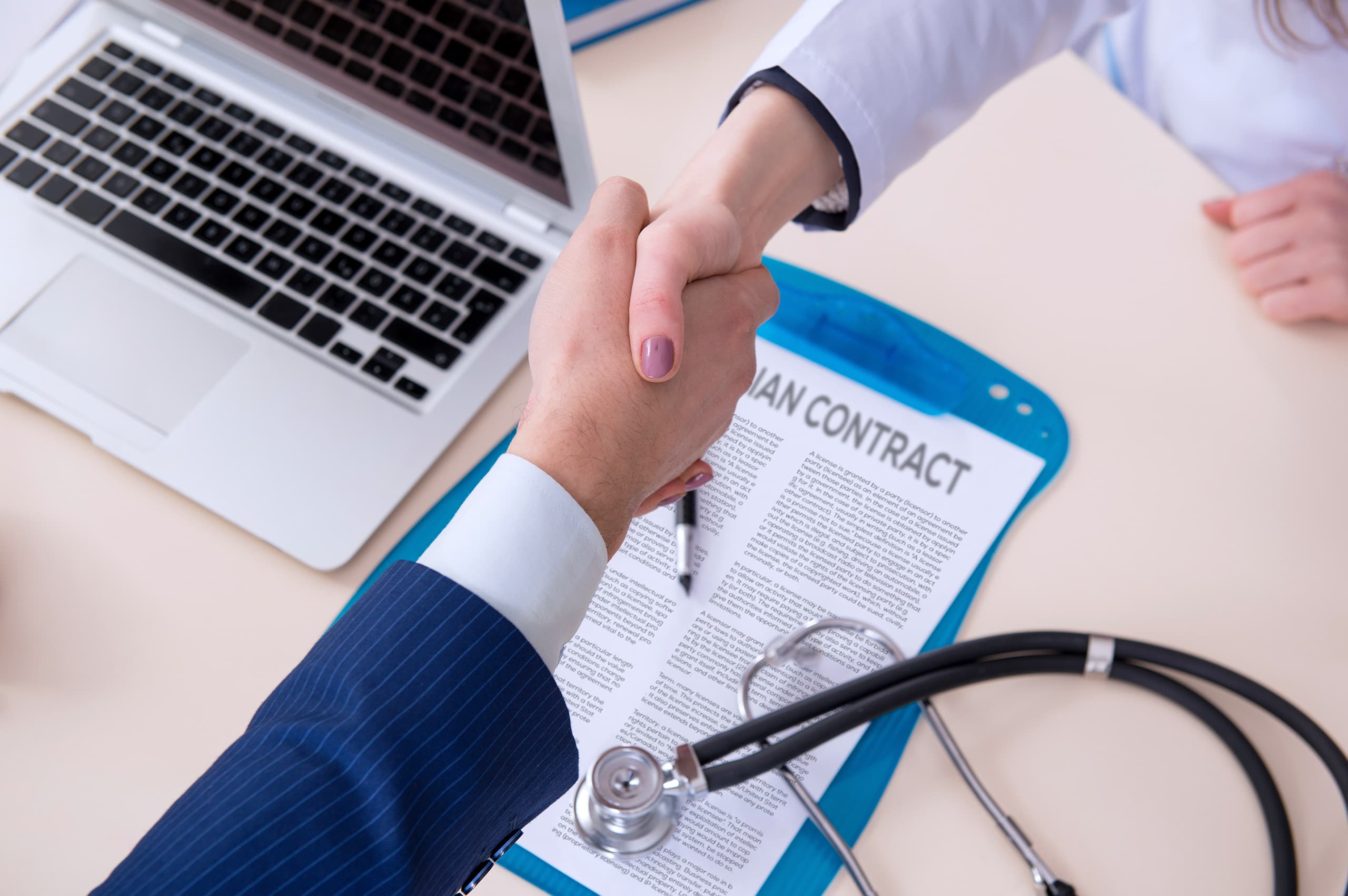 A physician reviewing a locum tenens contract